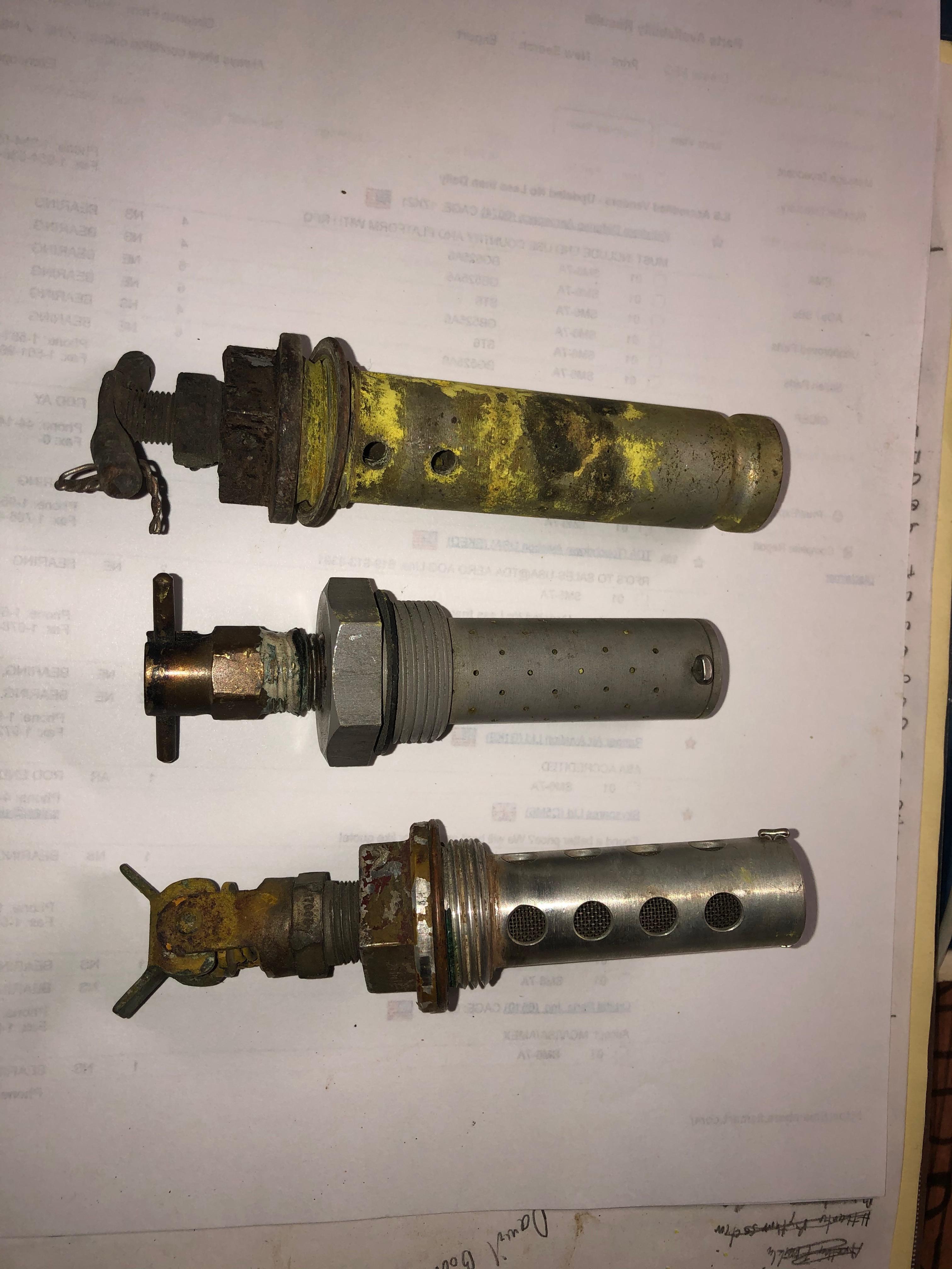 Fuel desiccant drain valve assy